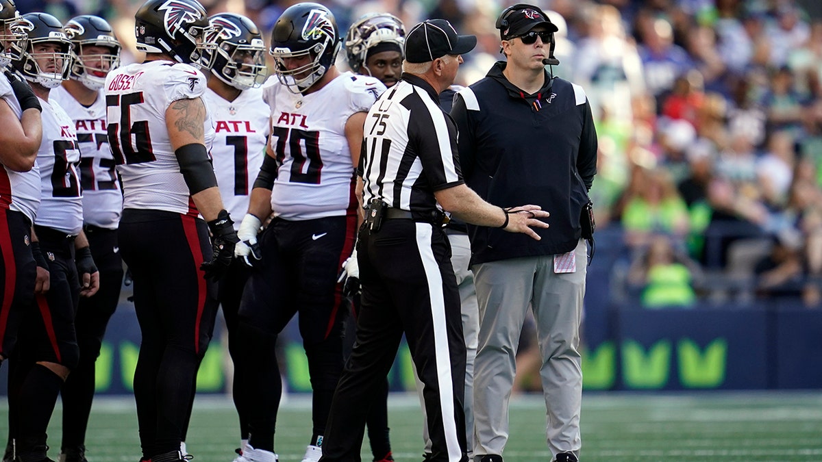 Falcons players on the sideline