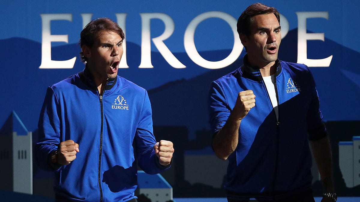 Rafael Nadal and Roger Federer celebrate