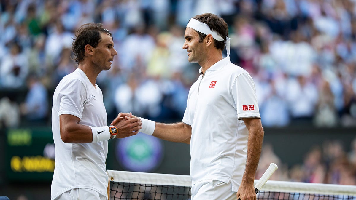Roger Federer shakes hands with Rafael Nadal