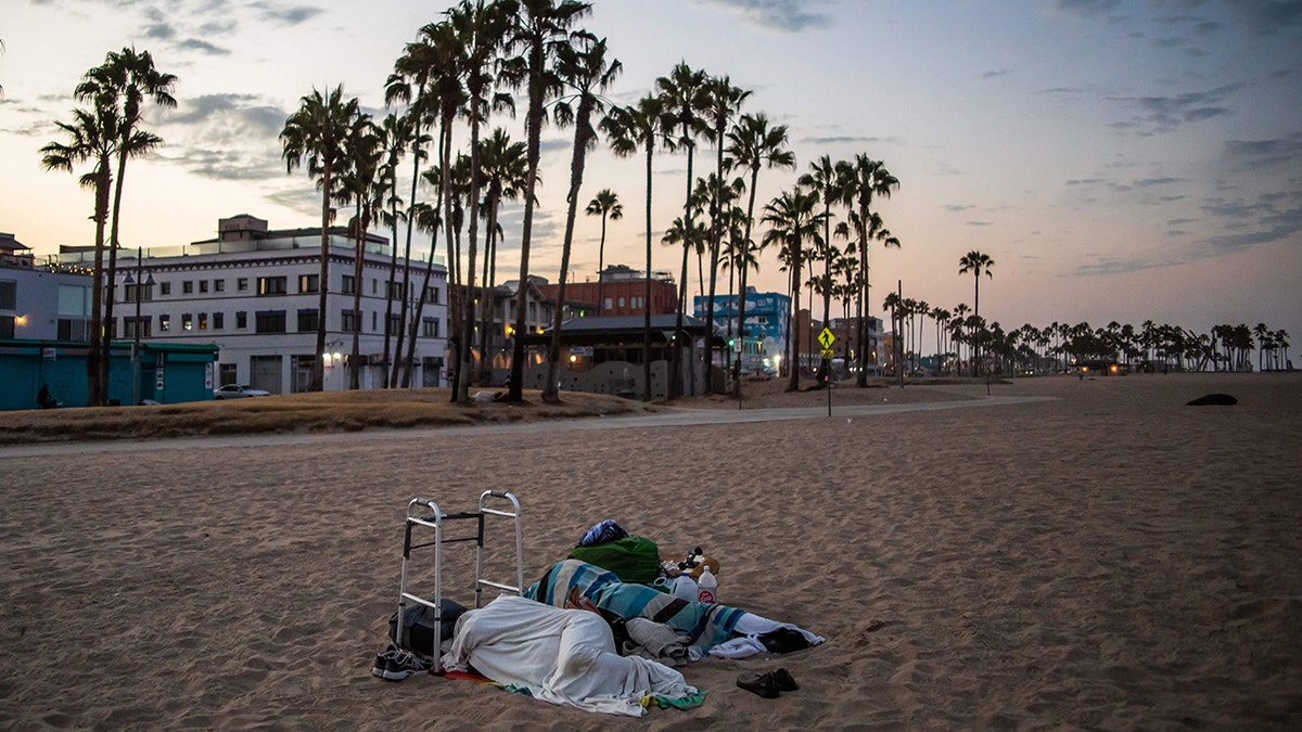 homeless people sleep on California beach