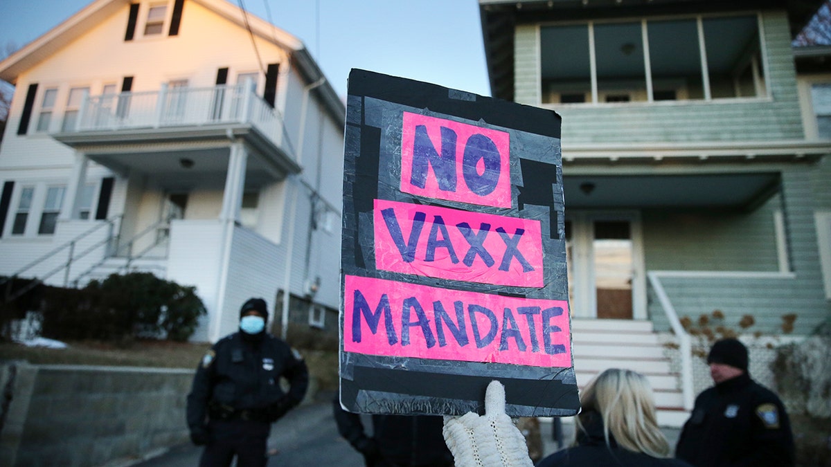 no vaxx mandate sign outside boston mayor's home