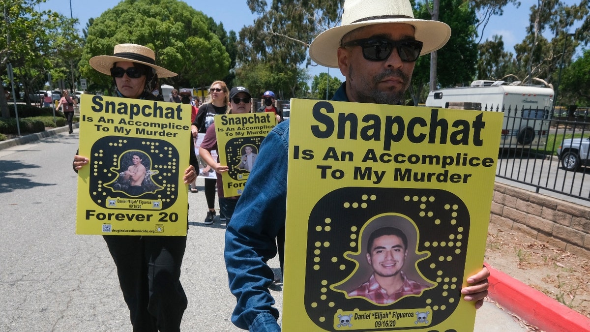 People opposed to the sale of illegal drugs on Snapchat participate in a rally outside the company's headquarters in June.