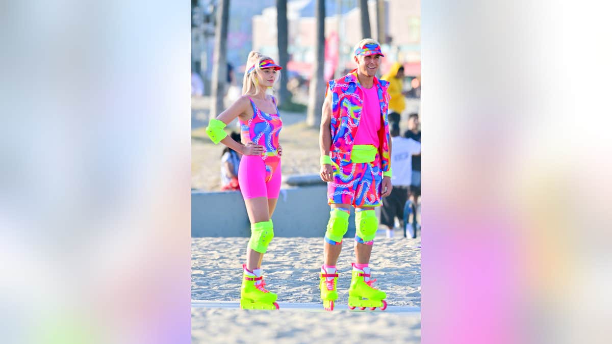 Margot and Ryan posing on set of Barbie