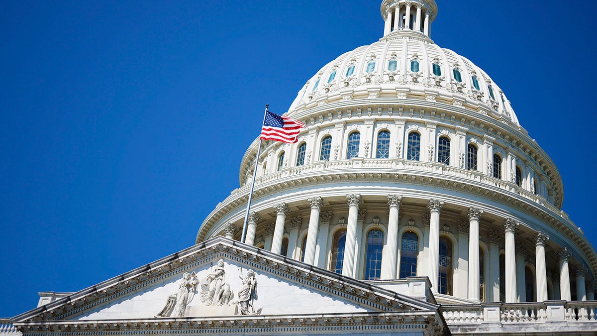 Capitol dome with flag flowing