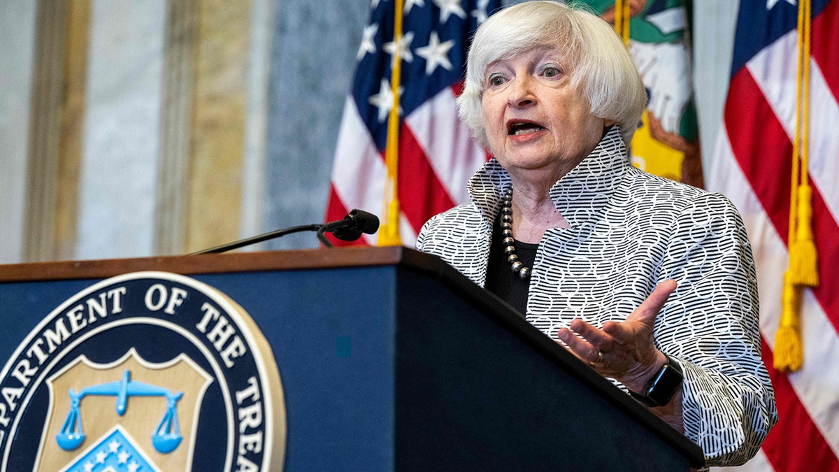 Janet Yellen behind a podium