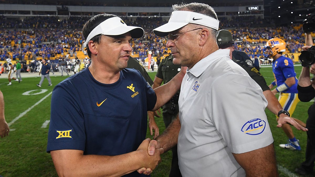 Pat Narduzzi and Neal Brown shake hands after the game