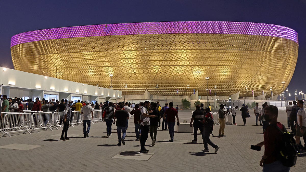 People arrive at Lusail Stadium in Qatar