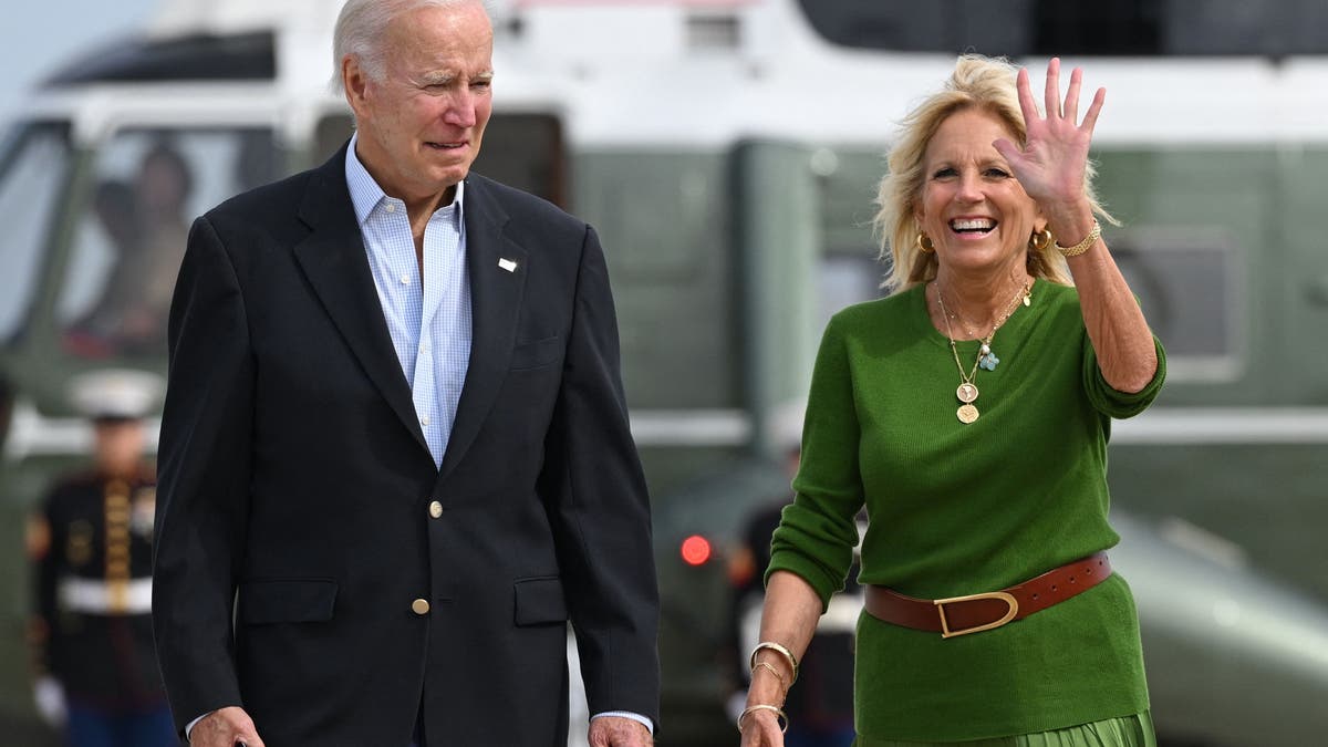 President Joe Biden and first lady Jill Biden walking.