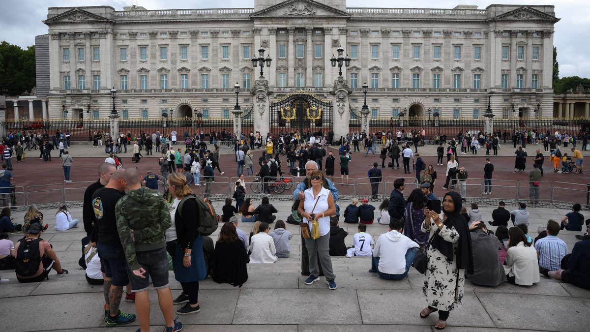 People outside of Buckingham Palace worried about Queen Elizabeth II