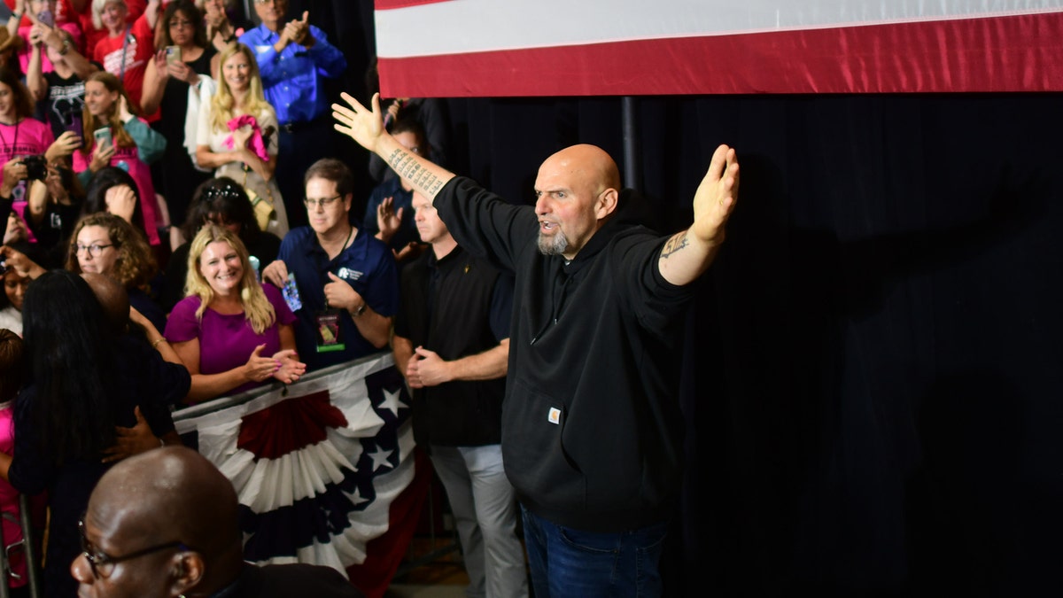 Democratic Pennsylvania Senate nominee John Fetterman acknowledges supporters during a rally