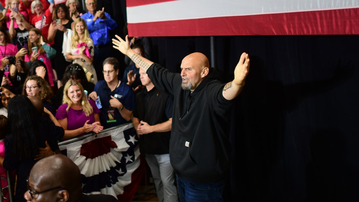 Democratic Pennsylvania Senate nominee John Fetterman acknowledges supporters during a rally