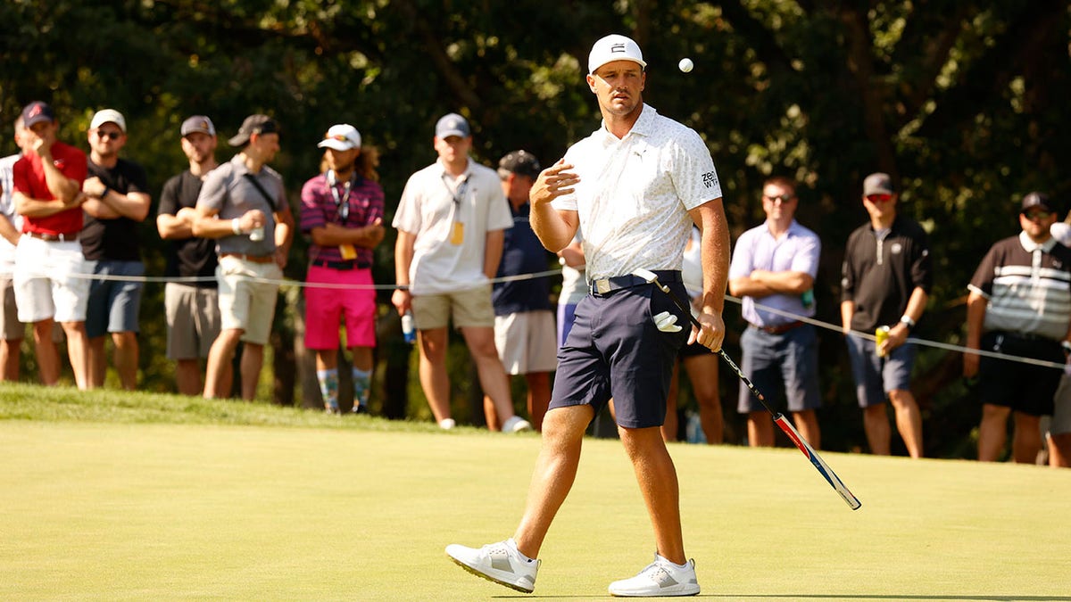 Bryson DeChambeau flips the golf ball at LIV Chicago