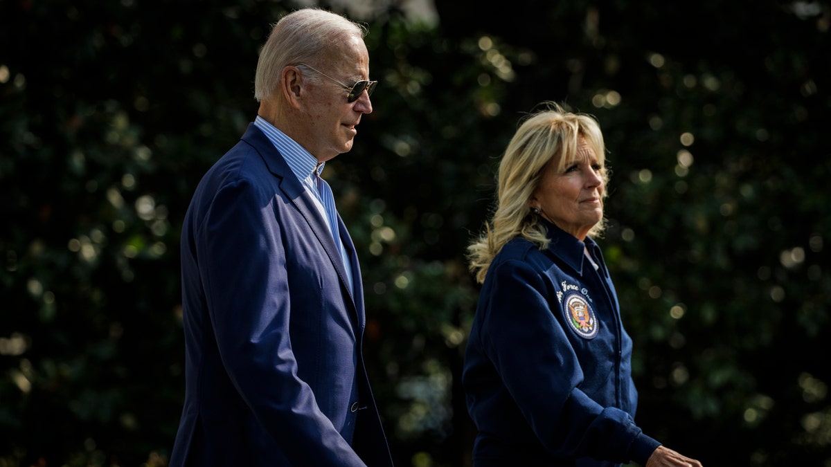 President Joe Biden and first lady Jill Biden walk to Marine One