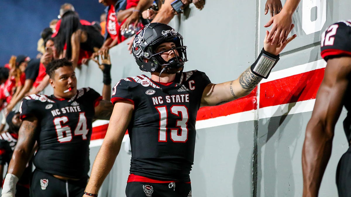 Devin Leary of NC State celebrates after beating Texas Tech