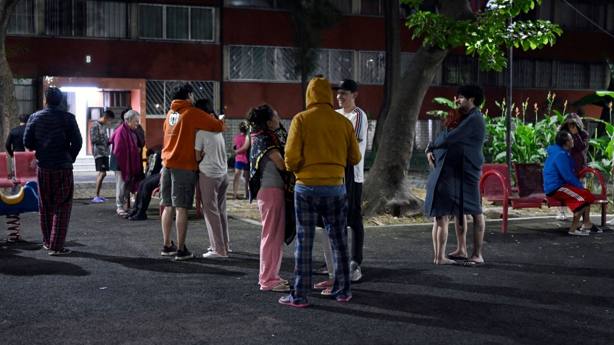 Mexicans stand in street after earthquake