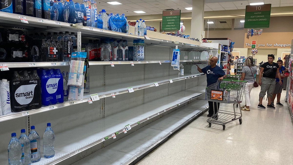 A photo of empty shelves at a Publix store