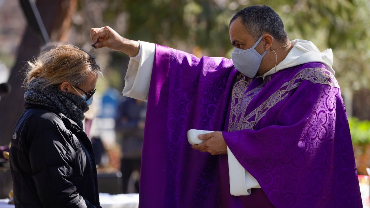 Father Michael Amabisco during Ash Wednesday