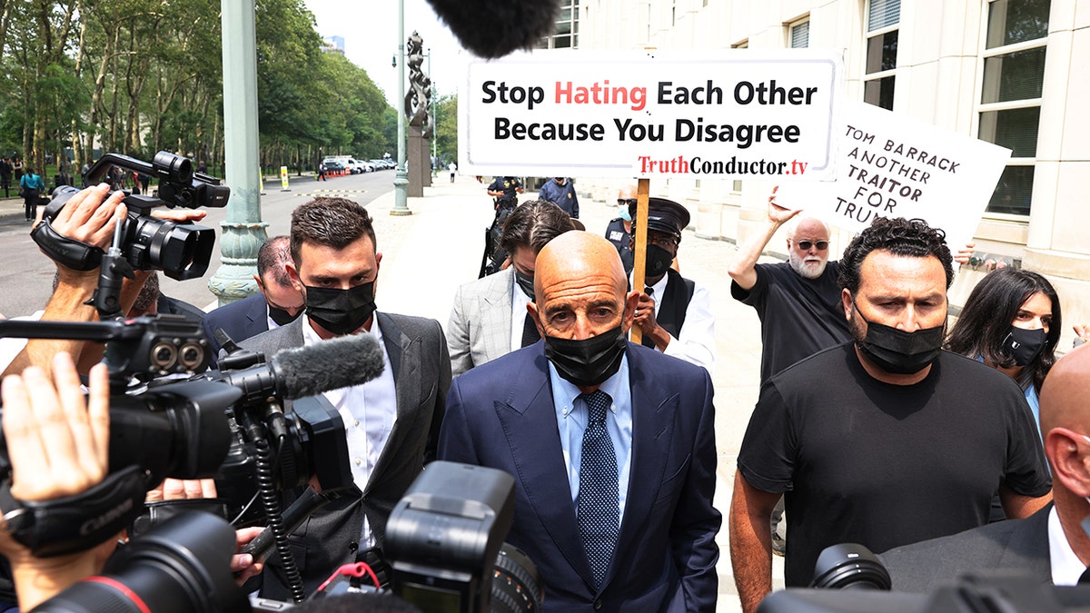 Tom Barrack swarmed by media outside court