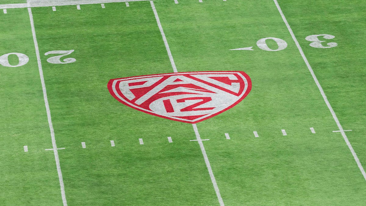 The Pac 12 logo on a football field