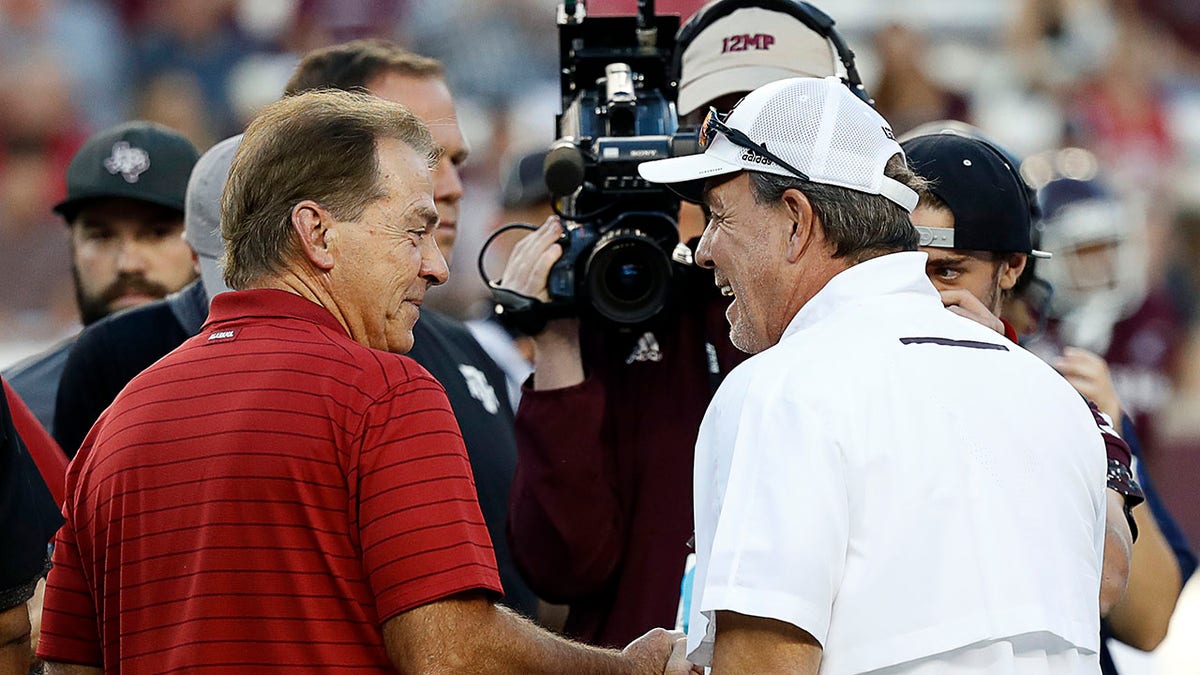 Nick Saban and Jimbo Fisher shake hands after a Texas A&M win