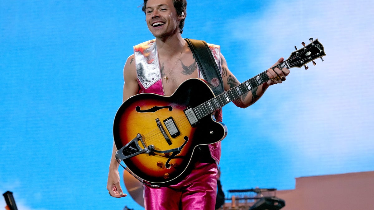 Harry Styles on stage performing