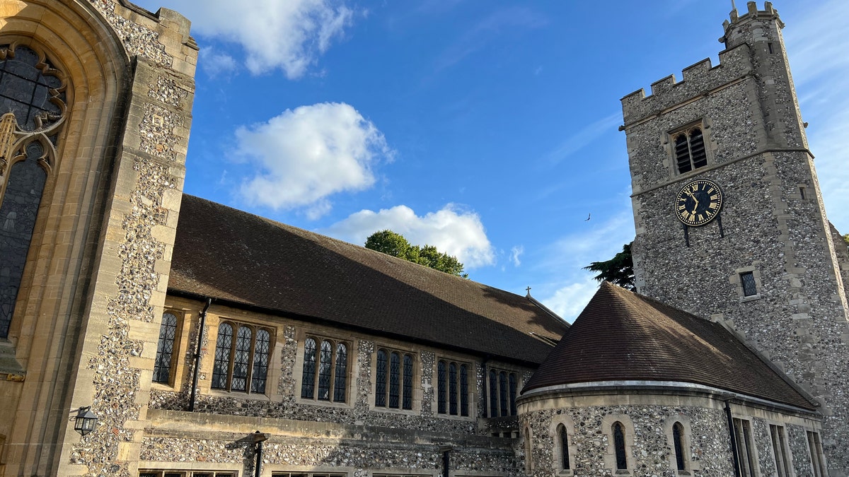 Rainbow flag atop tower of church building