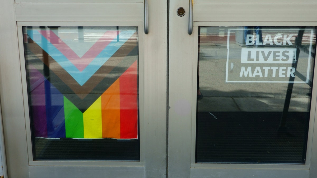 LGBTQ and BLM flags in school doors