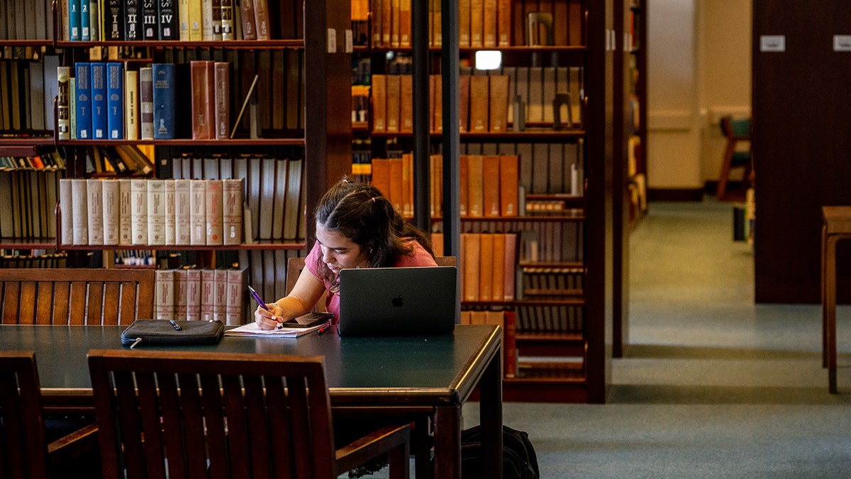 Student studying at the Rice University Library