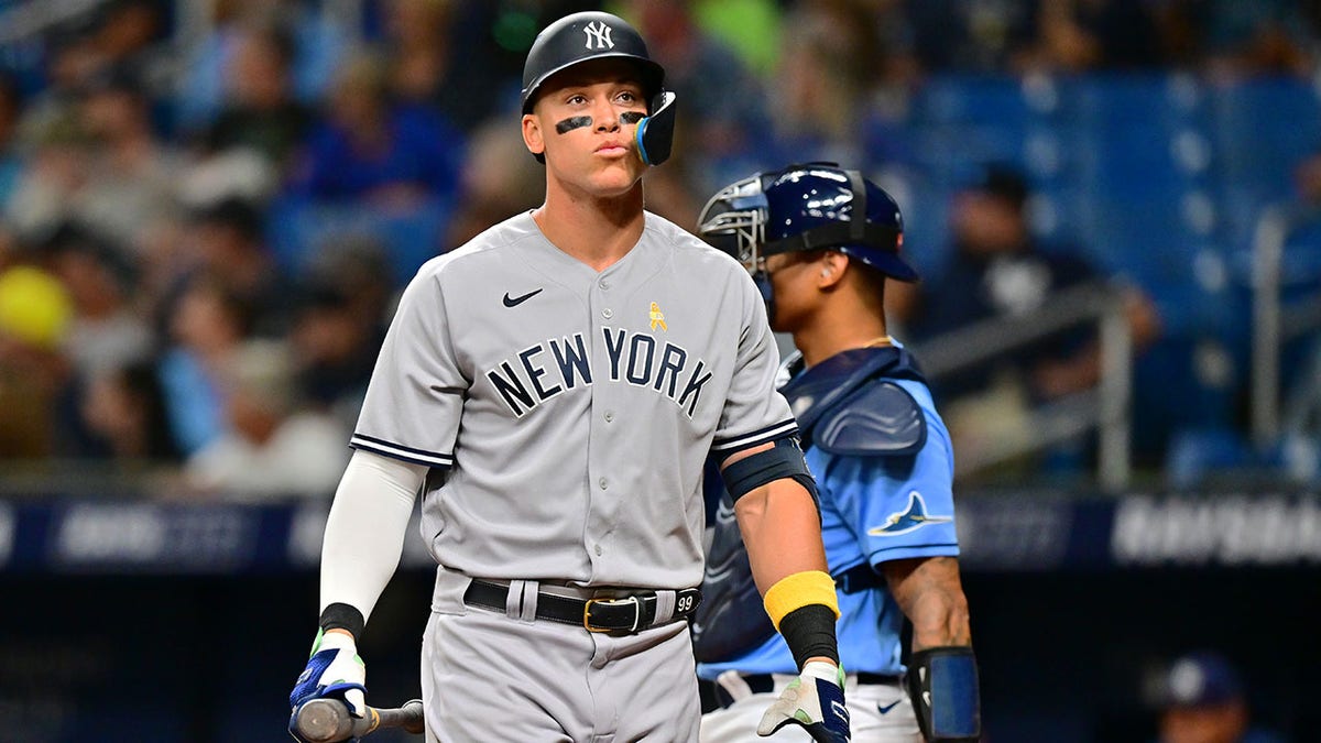 Aaron Judge walks back to the dugout after striking out