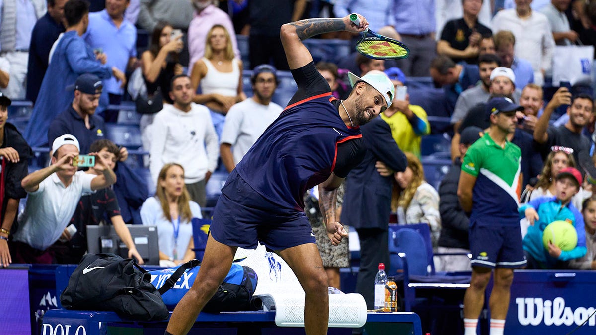 Nick Kyrgios throws racket