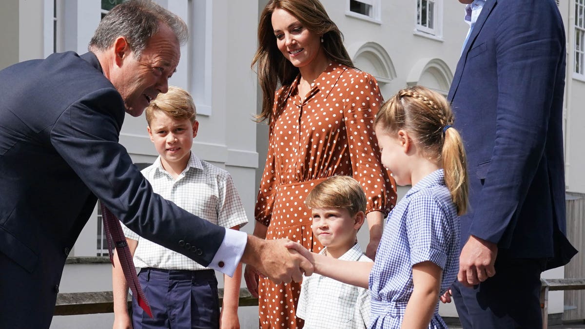 Princess Charlotte shaking hands