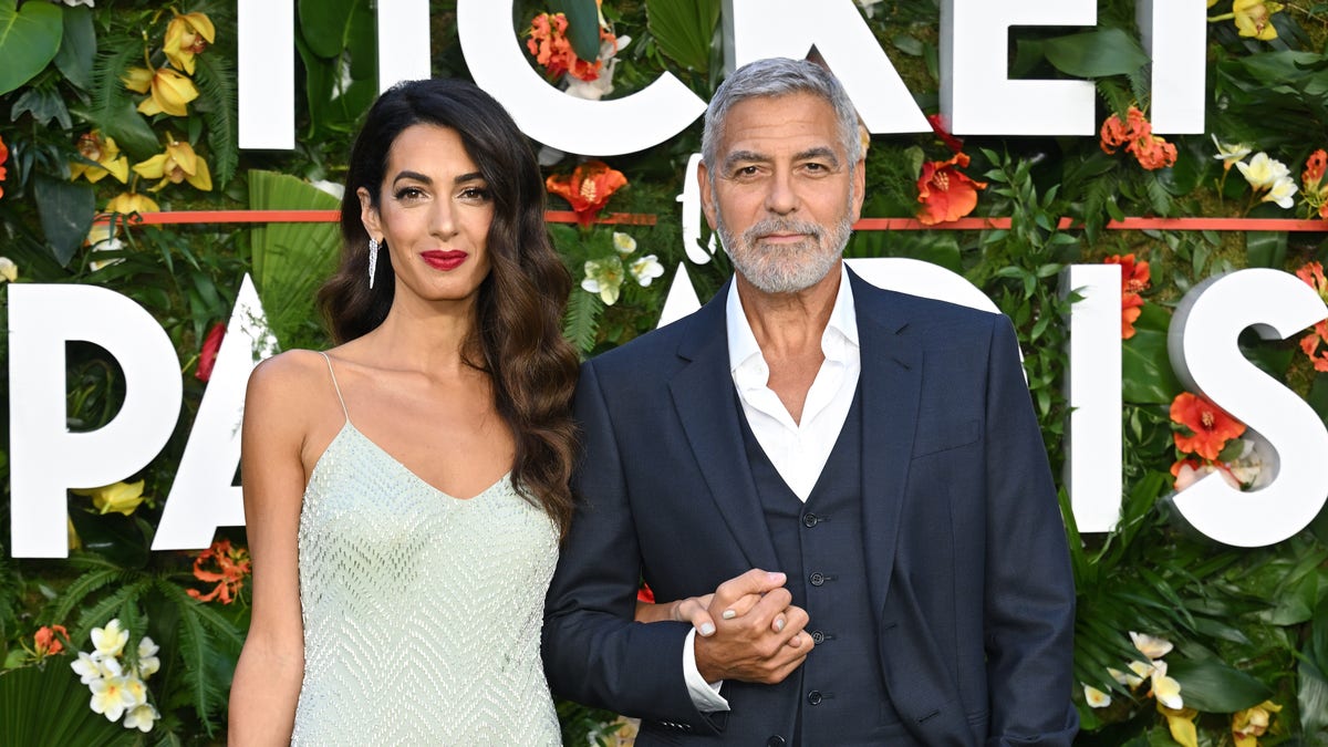 George Clooney and Amal at a movie premiere