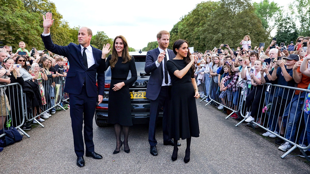 Catherine, Princess of Wales, Prince William, Prince of Wales, Prince Harry, Duke of Sussex, and Meghan, Duchess of Sussex wave goodbye to crowds at Windsor Castle