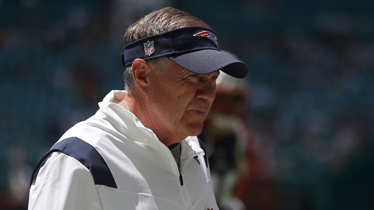 Bill Belichick looks on the field