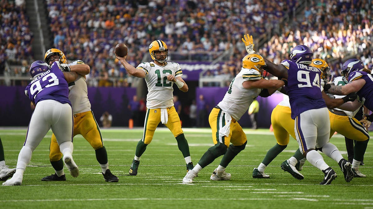 Aaron Rodgers throws a pass