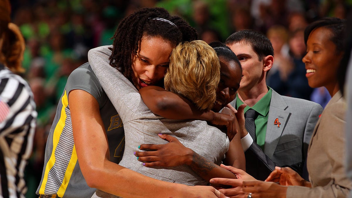 Brittney Griner hugs coach Kim Mulkey