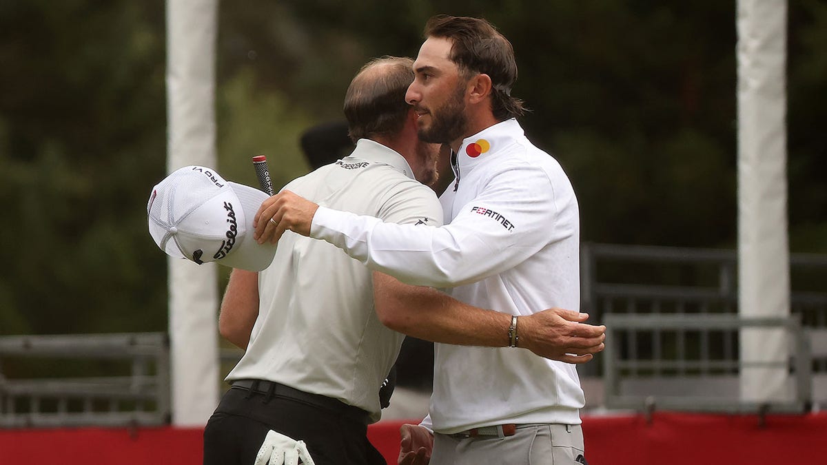 Max Homa hugs Danny Willett