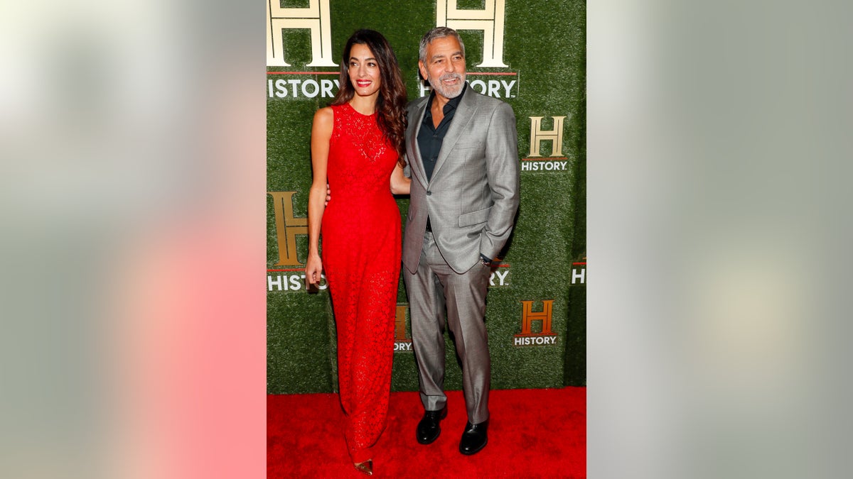 George and Amal Clooney on the red carpet in DC