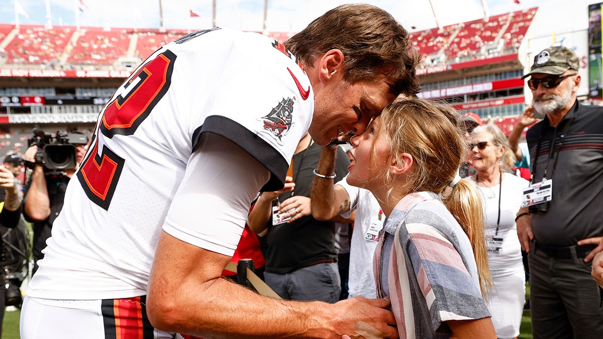 Tom Brady with his daughter before his game