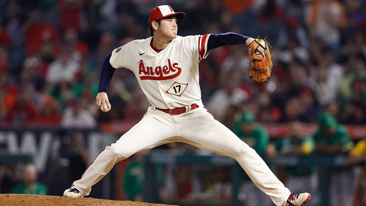 Shohei Ohtani pitches in the eighth inning