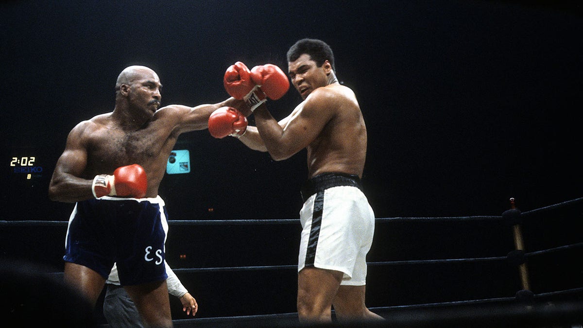 Earnie Shavers throws a punch against Muhammad Ali