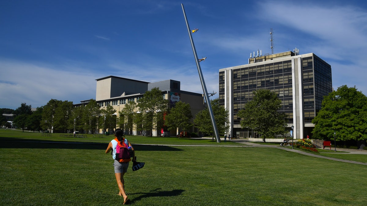 Student walking across Carnegie Mellon campus