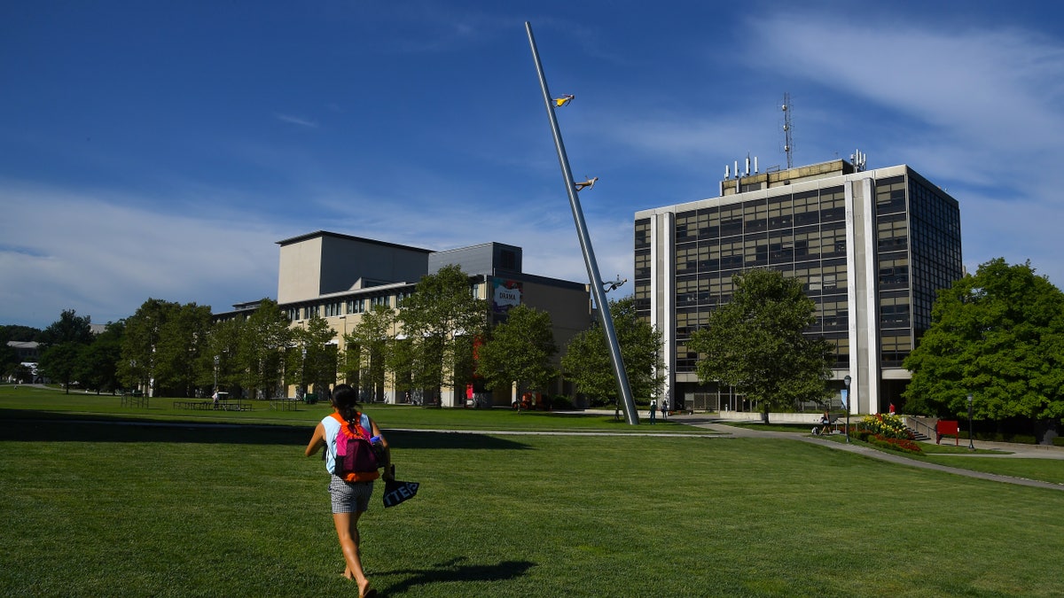 Student walking across Carnegie Mellon campus