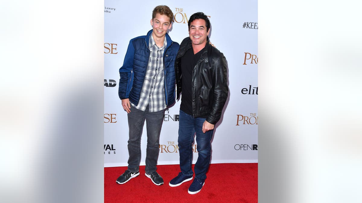 Dean Cain and his son Christopher on a red carpet