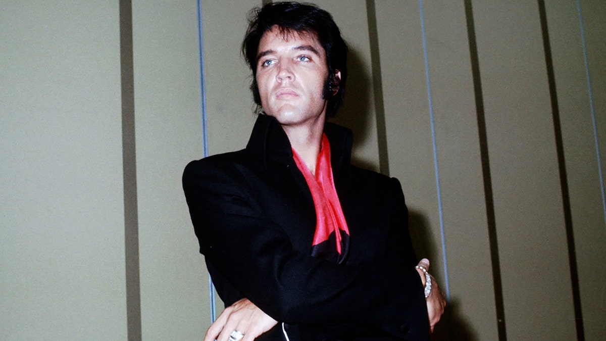 Rock and roll musician Elvis Presley during a press conference