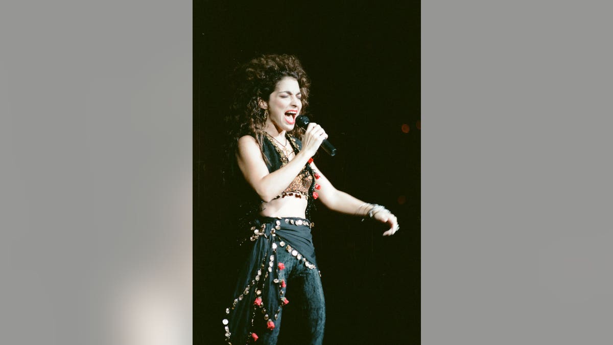 Gloria Estefan shows off her abs in a crop top and pants