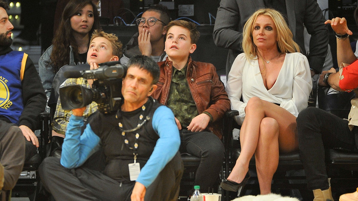 Britney Spears with two sons at basketball game