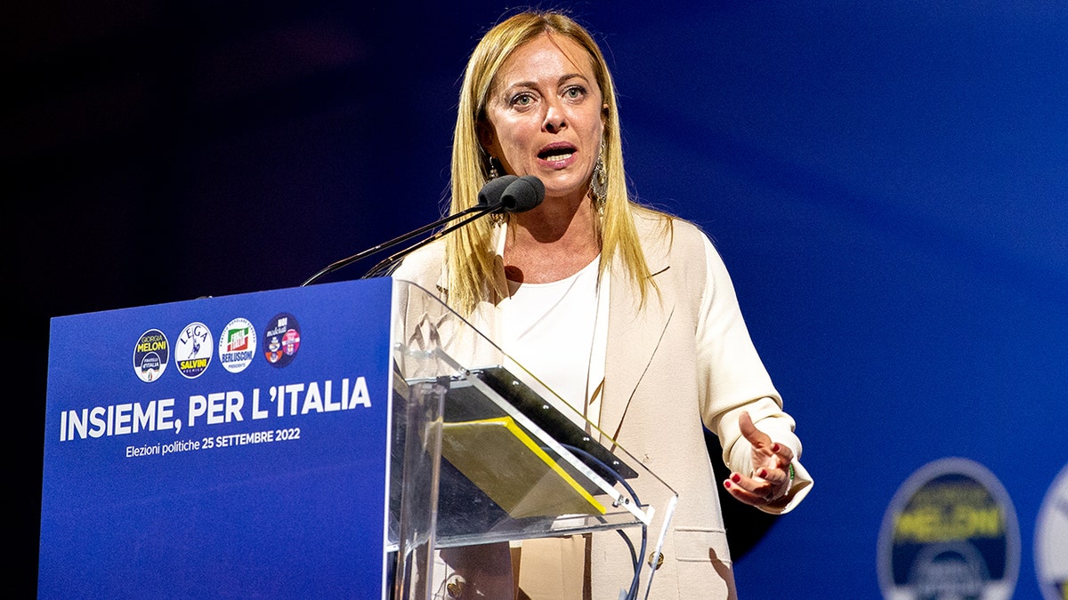 Giorgia Meloni speaks on the podium during the election campaign