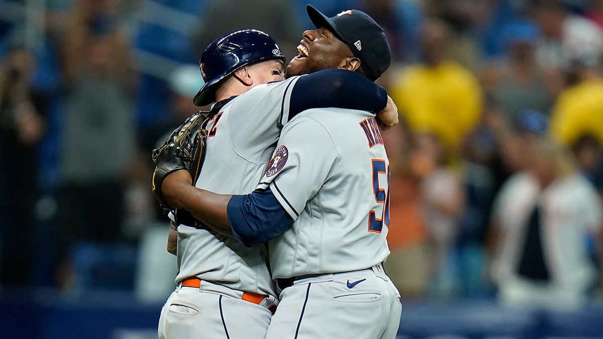 Hector Neris and Christian Vazquez celebrate