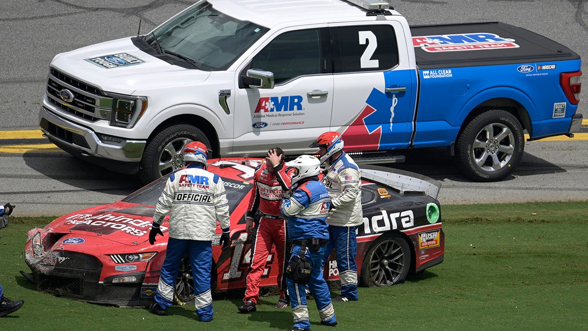 Chase Briscoe helped after crash at the NASCAR Cup Series auto race at Daytona International Speedway